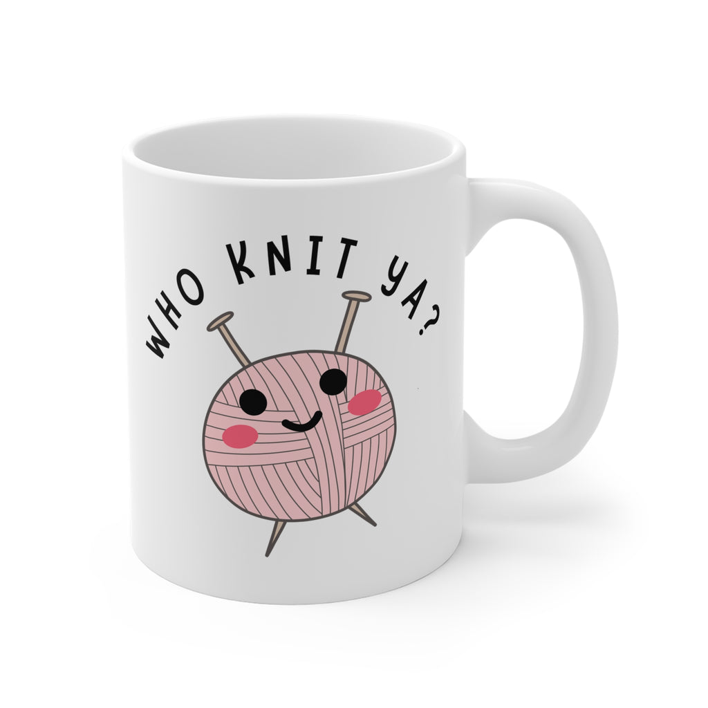 White mug with a pink yarn ball and knitting needles design, featuring the text 'WHO KNIT YA?' on a white background.